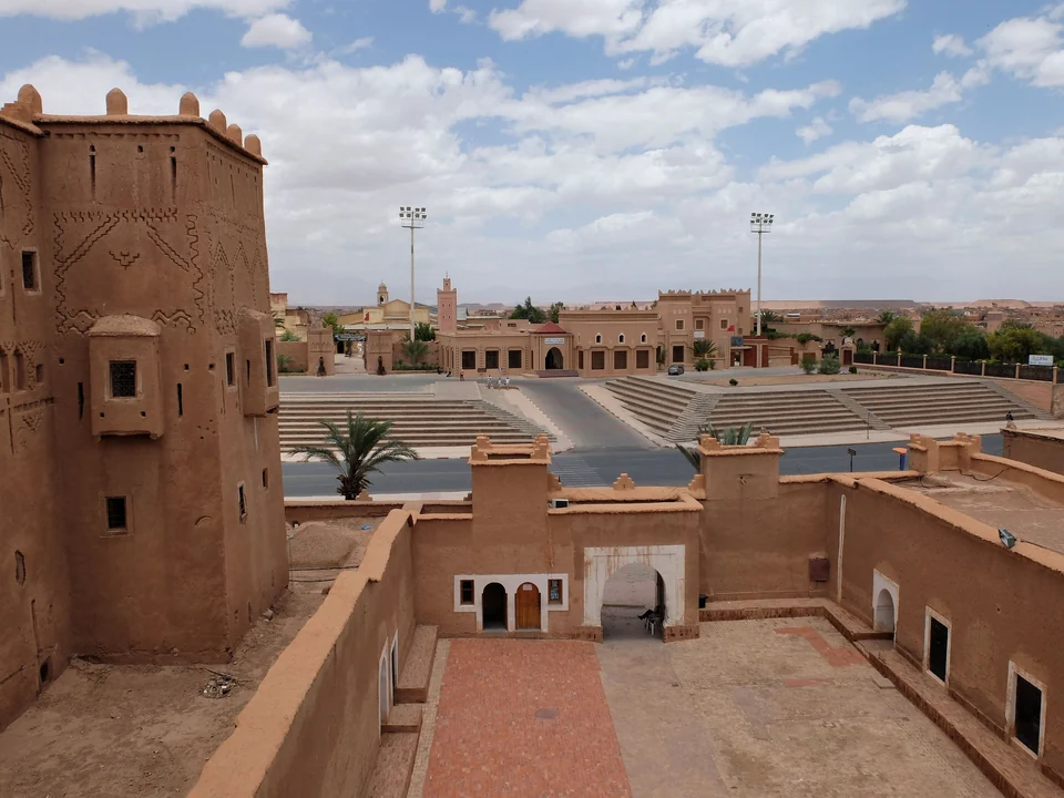 Courtyard and decorated earthen tower of the Taourirt Kasbah in Ouarzazate, Morocco