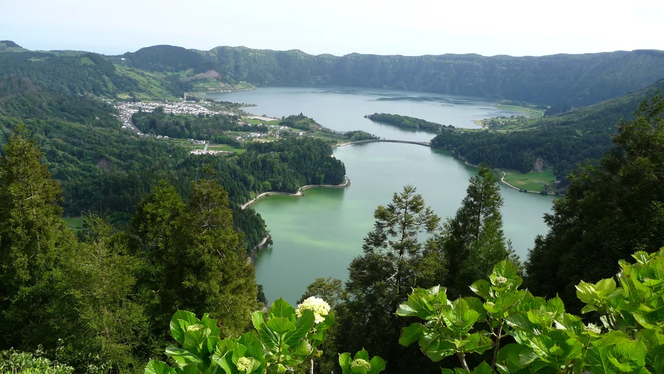The green and blue lakes of Sete Cidades in their volcanic crater on São Miguel, seen from the Vista do Rei viewpoint