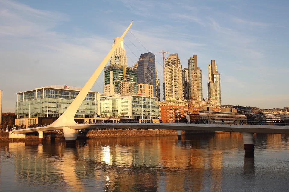 The white Puente de la Mujer footbridge crossing a dock in Puerto Madero, Buenos Aires