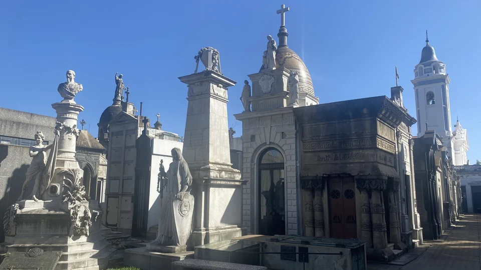 Rows of stone mausoleums and statues at Recoleta Cemetery in Buenos Aires