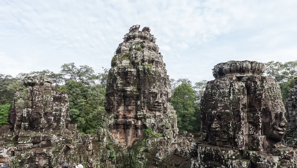 Stone faces carved on the towers of the Bayon temple in Angkor Thom, Cambodia