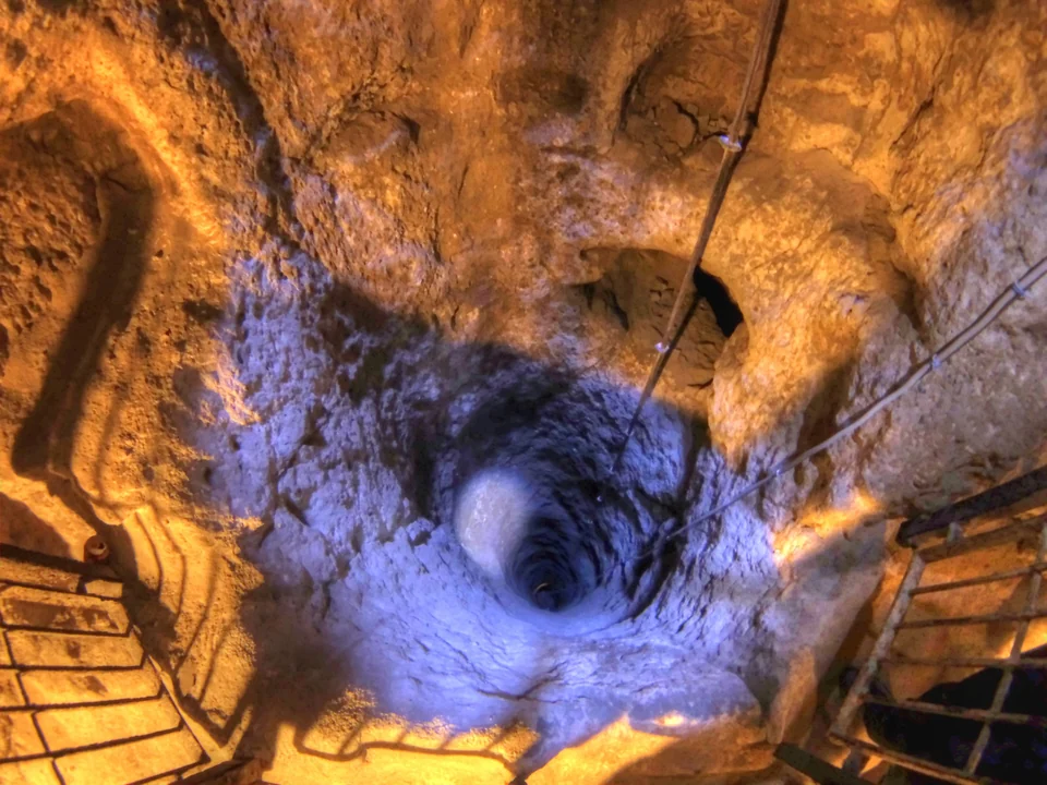 Narrow carved tunnel and chamber inside Derinkuyu Underground City in Cappadocia