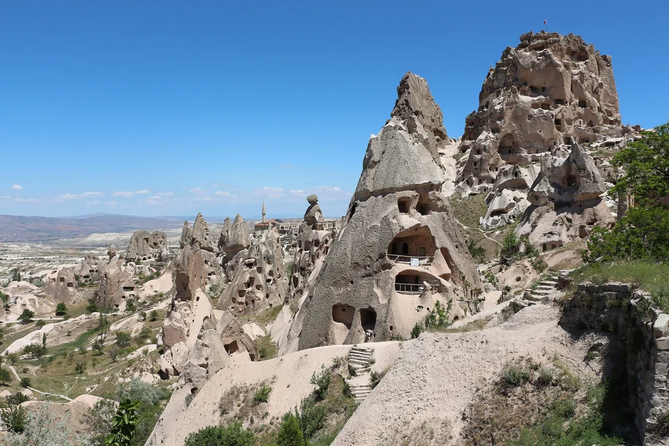 Uçhisar Castle, a large honeycombed rock outcrop rising above the village in Cappadocia
