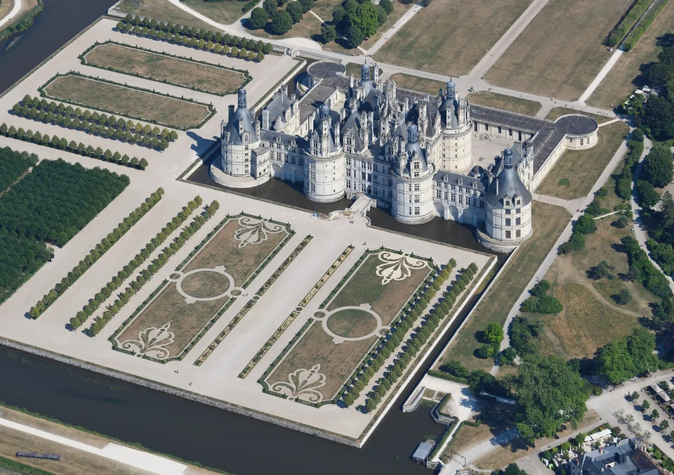 Aerial view of the Château de Chambord in the Loire Valley with its towers, formal gardens and wooded park