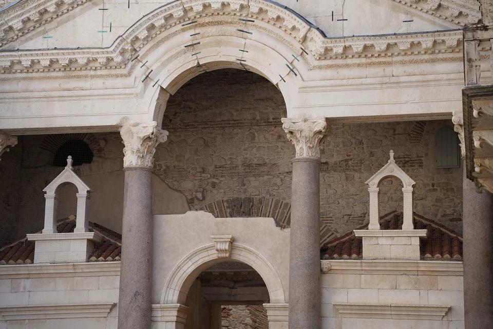 Granite columns, Corinthian capitals and a central arch on the Peristyle of Diocletian's Palace in Split