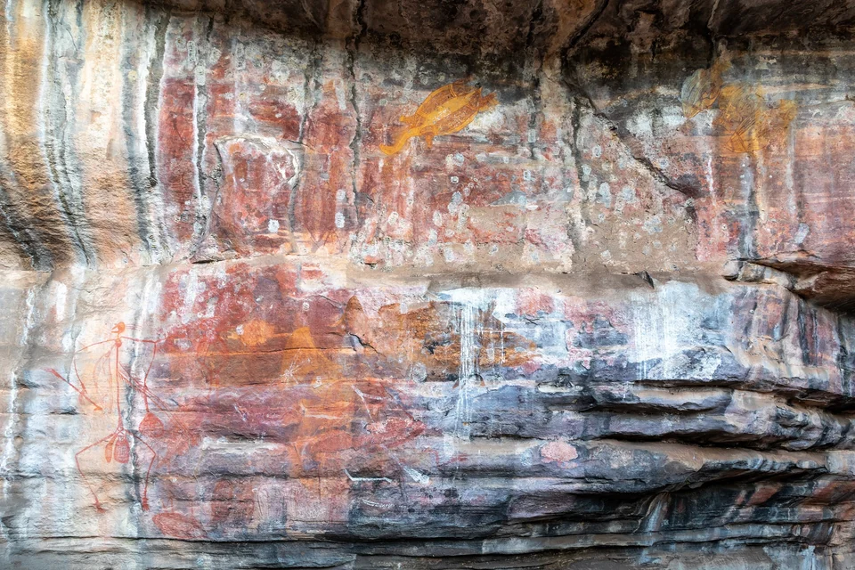 Ochre Aboriginal rock art paintings on a sandstone overhang at Ubirr in Kakadu National Park, Northern Territory