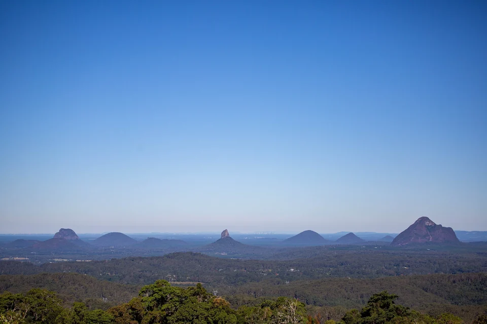 Volcanic peaks of the Glass House Mountains rising above green bushland on the Sunshine Coast hinterland, Queensland