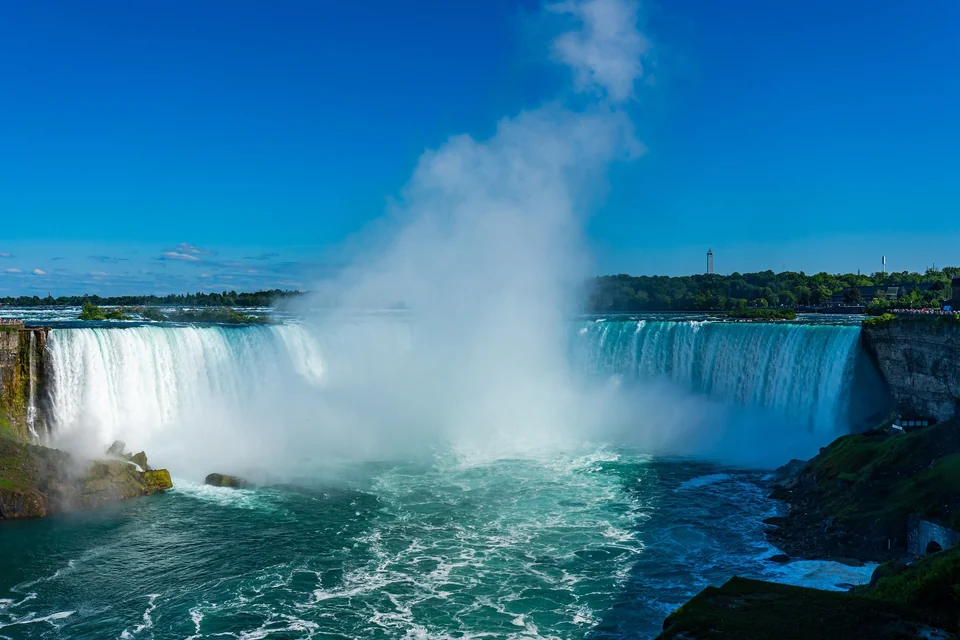 Horseshoe Falls at Niagara Falls, Ontario, with white water and mist rising from the Niagara River