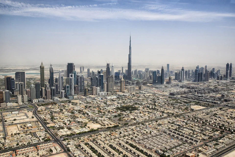 Aerial view of the Dubai skyline with Burj Khalifa rising above Downtown and the Sheikh Zayed Road towers