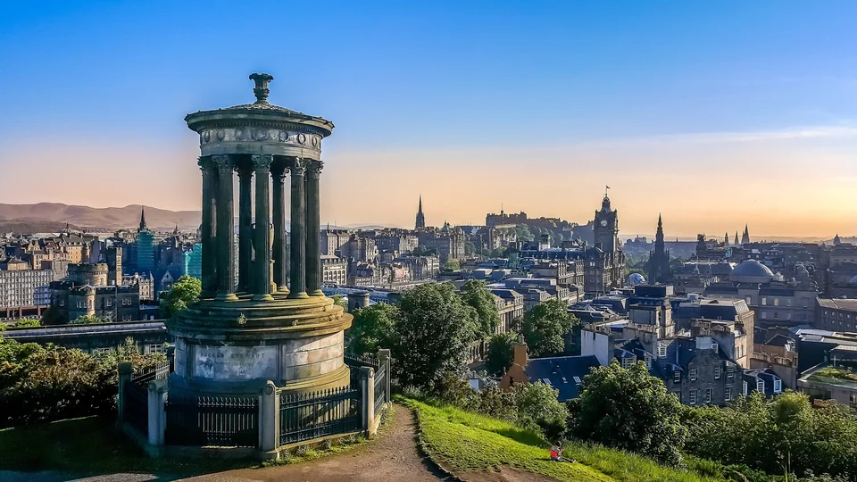 Skyline of Edinburgh with the Old Town rooftops, castle and spires seen across the city