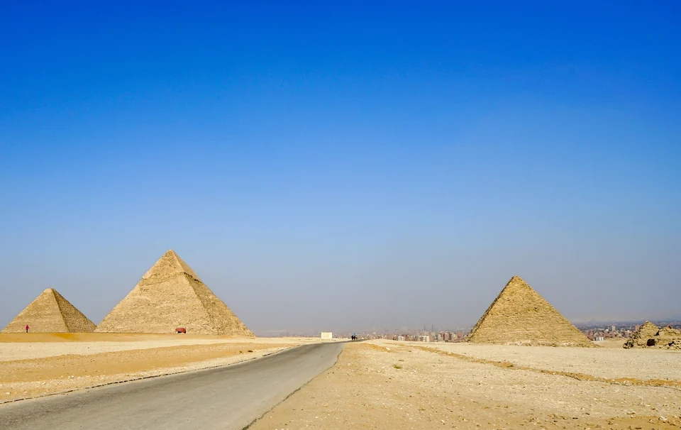 The pyramids of Giza rising above the desert plateau near Cairo, Egypt