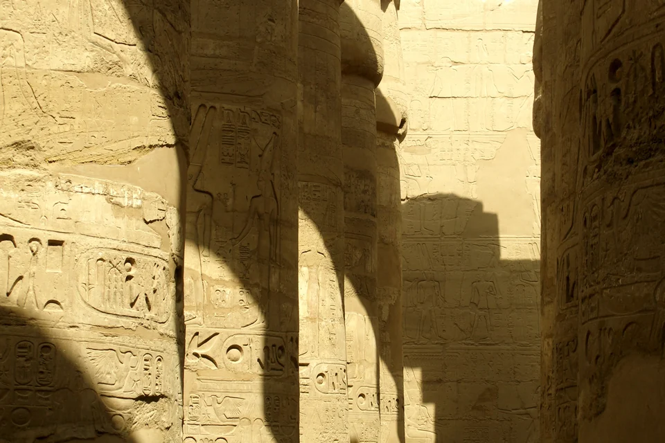 Rows of towering carved columns in the Great Hypostyle Hall at Karnak Temple, Luxor