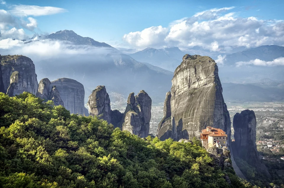 Monasteries of Meteora on top of sandstone rock pillars in the morning light, central Greece