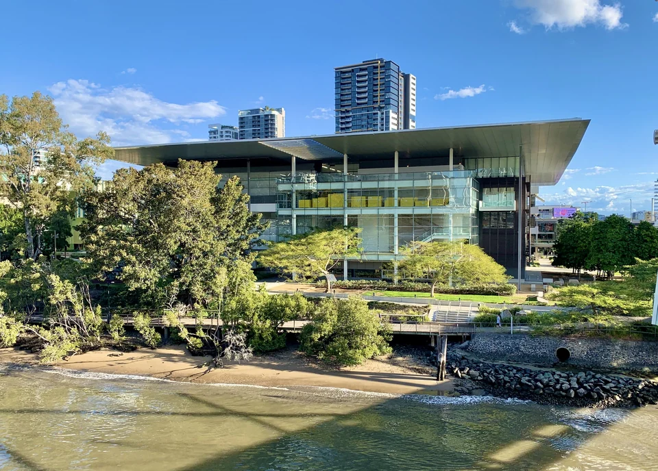 Glass and steel Gallery of Modern Art building on the Brisbane River bank at Kurilpa Point