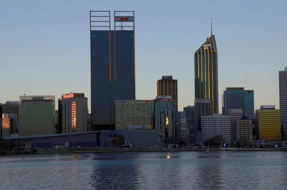 Perth city skyline at sunset reflected in the Swan River, seen from South Perth