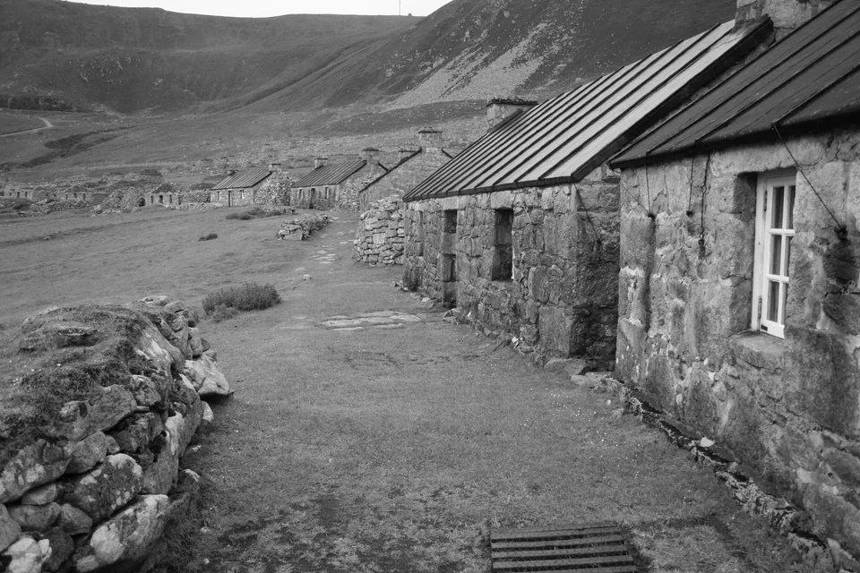 Row of stone cottages along the Main Street of the abandoned village in Village Bay, Hirta, St Kilda