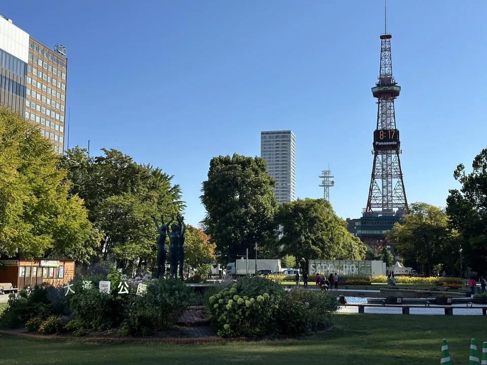 Wide green lawns and tree-lined paths in Odori Park in the center of Sapporo