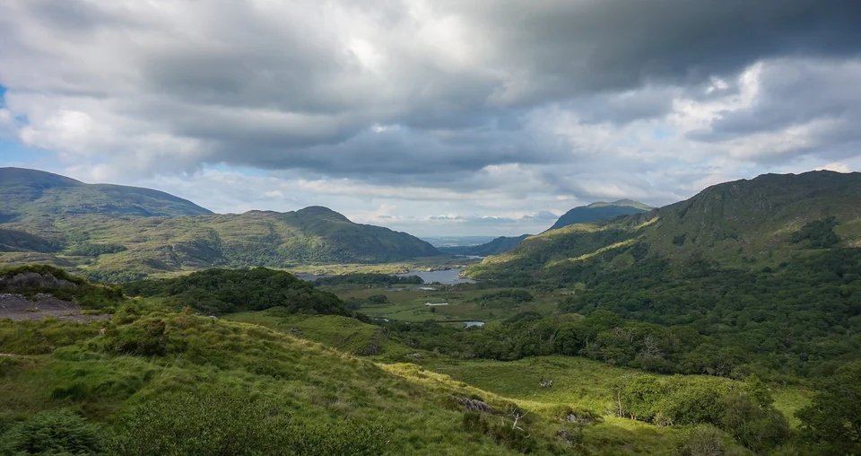Wide view over lakes and wooded hills from Ladies View in Killarney National Park