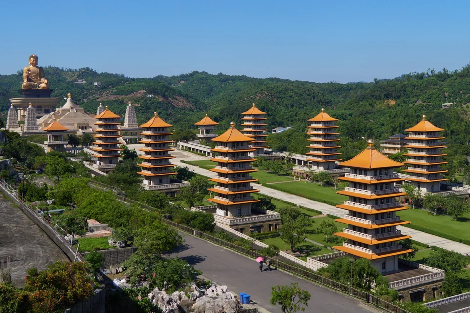 Rows of orange-roofed pagodas leading to the giant golden Buddha at Fo Guang Shan Buddha Museum near Kaohsiung