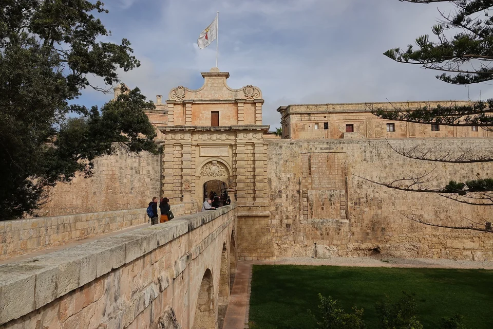 The Baroque Main Gate bridge leading into the walled city of Mdina, Malta
