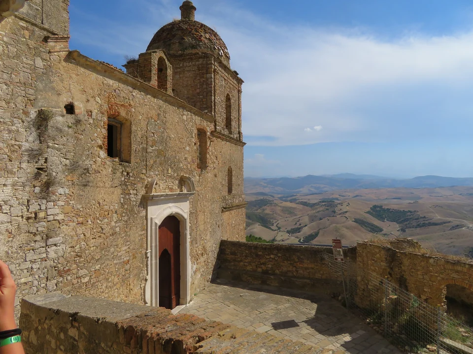 Abandoned stone buildings of the ghost town of Craco on a hilltop in Basilicata