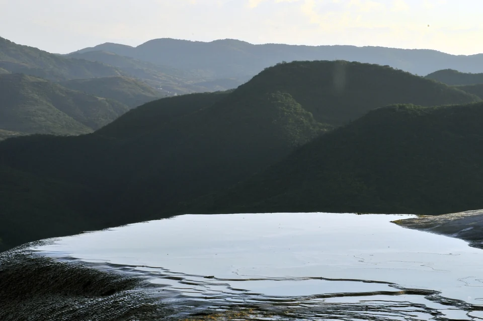 Mineral terraces and natural pools at Hierve el Agua above a valley in Oaxaca, Mexico