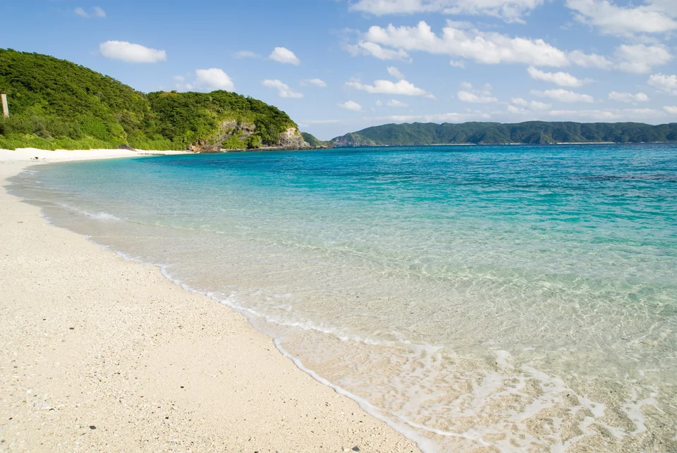 White sand and clear turquoise water at Furuzamami Beach on Zamami Island in Okinawa's Kerama Islands