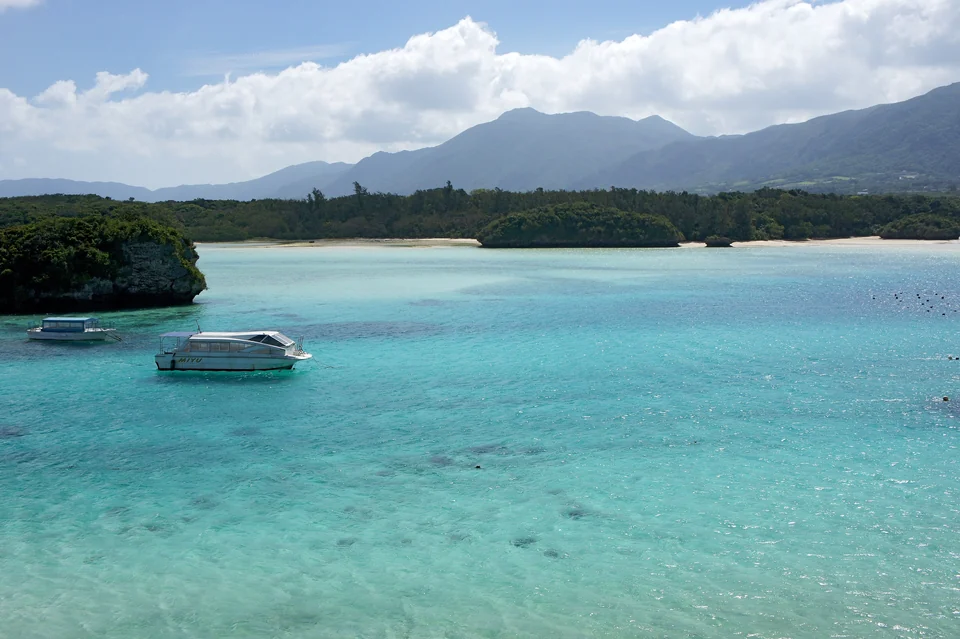 Small green islets in the emerald and blue water of Kabira Bay on Ishigaki Island, Okinawa