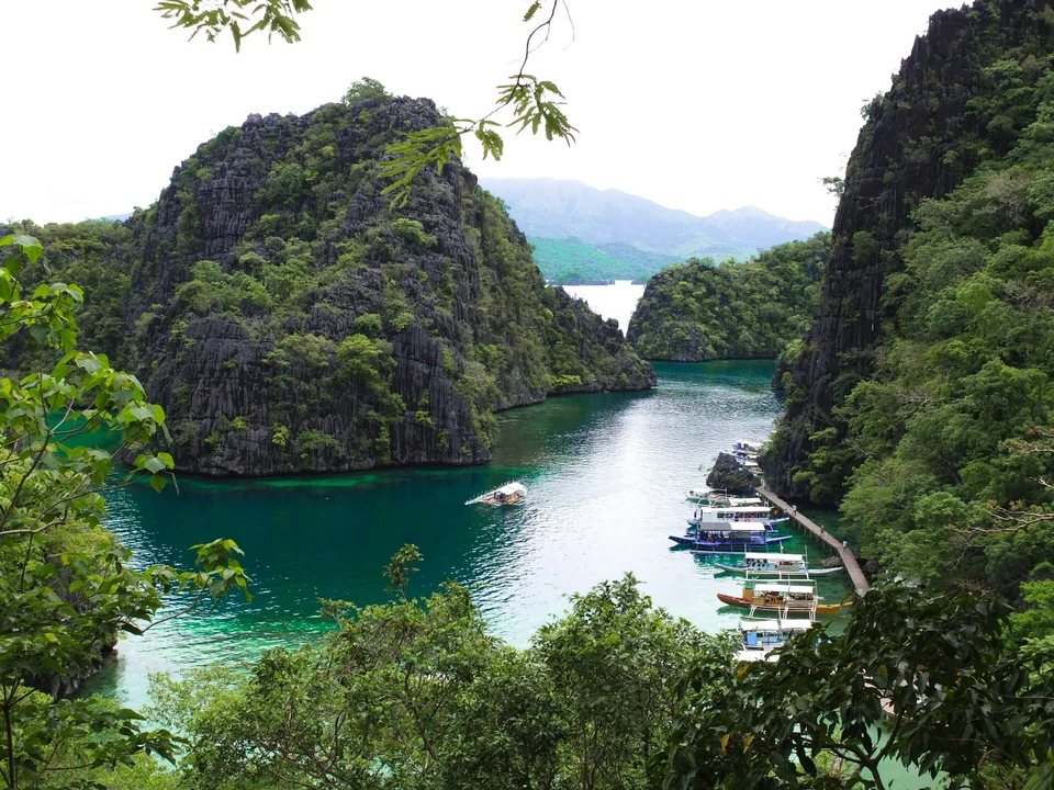 Kayangan Lake on Coron Island, Palawan, with clear water below steep limestone cliffs