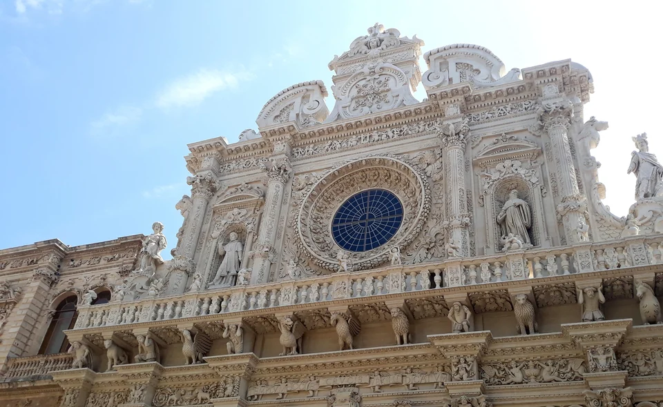 Ornate baroque facade of the Basilica di Santa Croce in Lecce, carved in golden local limestone