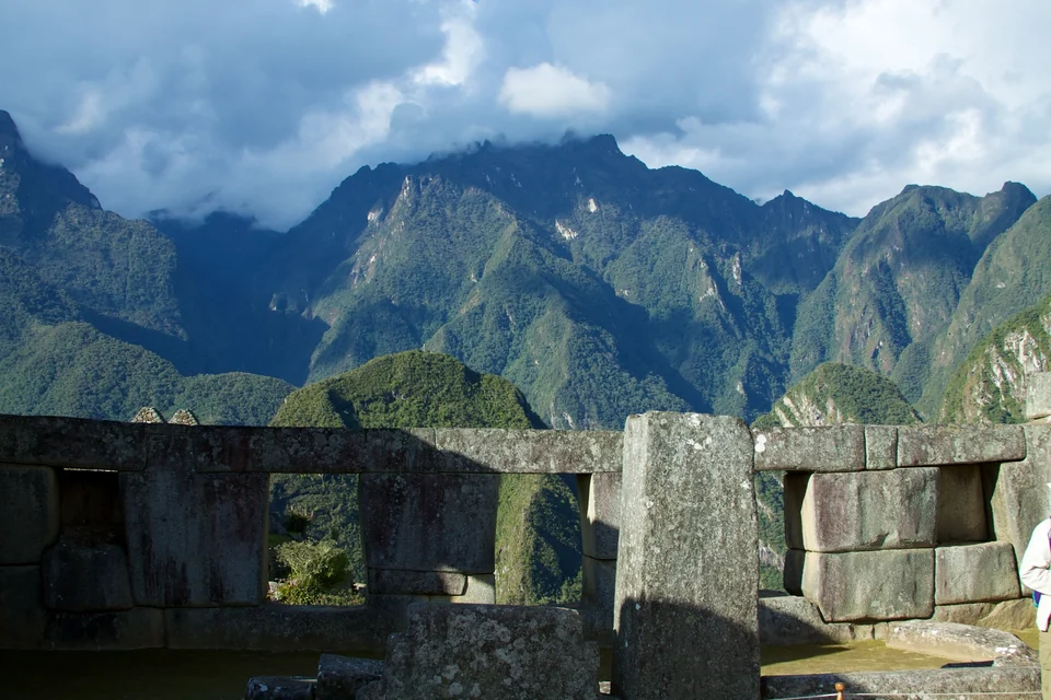Three trapezoidal windows framed by huge polygonal stone blocks in the Temple of the Three Windows, Machu Picchu