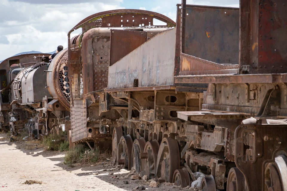Rusting steam locomotives and tenders at the train cemetery outside Uyuni, Bolivia