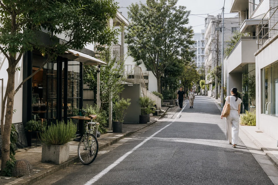 Quiet design-focused street in Daikanyama Tokyo with shops and bicycles