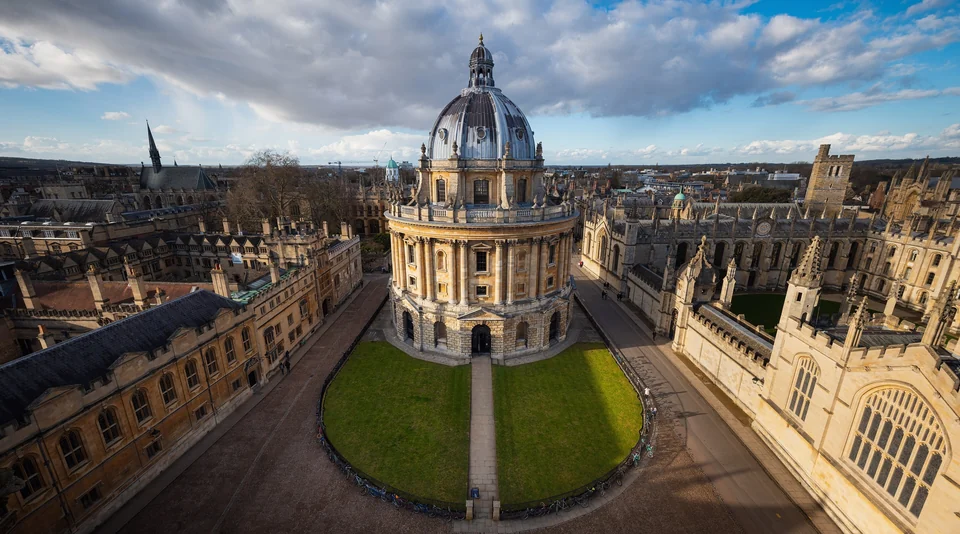 Radcliffe Camera library dome seen from above in Radcliffe Square, Oxford, surrounded by stone college buildings