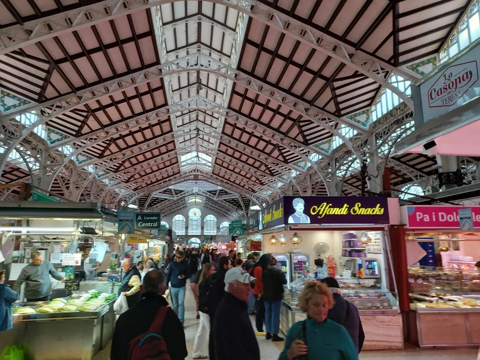 Facade of Valencia's Central Market with its tiled domes and Art Nouveau ironwork in the Old Town
