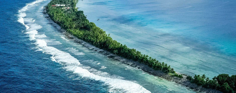 Lagoon and palm-fringed islet in Tuvalu