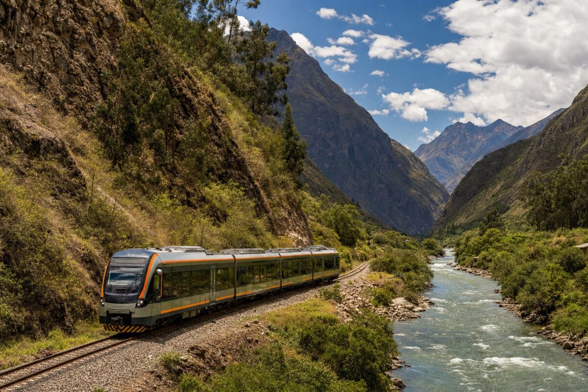 Passenger train following the Urubamba River through Peru Sacred Valley